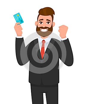 Happy young businessman showing credit, debit, ATM card. Man making raised hand fist gesture. Male character design illustration.