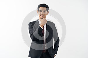 Happy young businessman smiling and thinking in formal suit isolated on white background