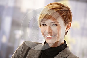 Happy young businesswoman in spring sunshine