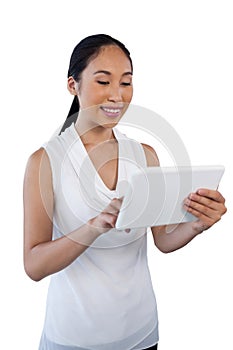 Happy young businesswoman using digital tablet