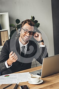 happy young call center worker in glasses