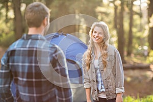 Happy young camper couple looking at each other