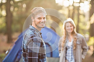 Happy young camper couple smiling