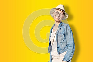 Happy young caucasian bald woman in hat and casual clothes enjoying life after surviving breast cancer. Portrait of beautiful