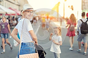 Happy young caucasian bald woman in hat and casual clothes enjoying life after surviving breast cancer. Portrait of beautiful