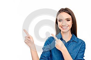 Happy young cheerful woman showing way with fingers