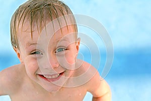 Happy Young Child Smiling in Swimming Pool
