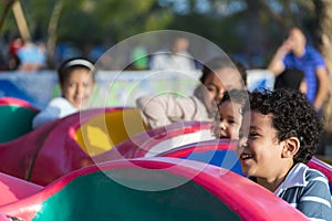 Happy Young Children at Amusement Park