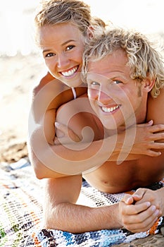 Happy young couple on the beach