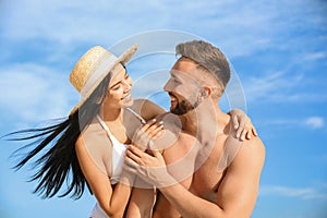 Happy young couple in beachwear