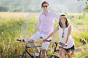 Happy young couple with bicycles