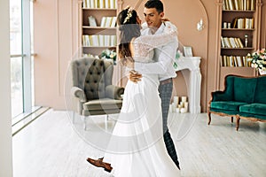 Happy young couple of bride and groom, First wedding dance, Newlyweds dancing together