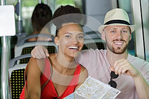 happy young couple in bus