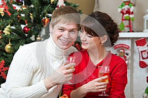 Happy young couple celebrating Christmas or new year