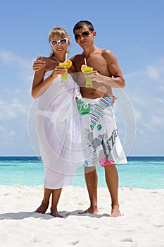 Happy young couple with a coctails