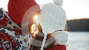 Happy young couple dating and kiss in winter outside at Xmas, holidays concept. Family weekend spend time together