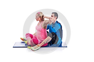 Happy young couple doing exercise in pair for pregnancy on the white background