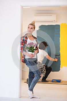 Happy young couple doing home renovations