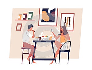 Happy young couple eating meal together in Scandinavian interior. Man and woman taking lunch at dining table. People
