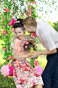 Happy young couple embracing in nature