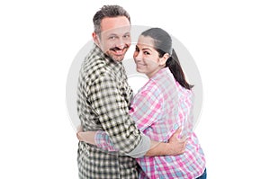 Happy young couple embracing and smiling