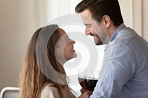 Happy young couple enjoy romantic dinner at home