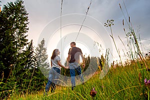 Happy young couple enjoy walking forest. Pure nature scenery