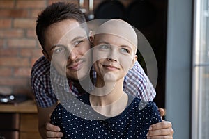 Happy young couple fighting against woman cancer