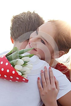 Happy young couple on first date, embracing