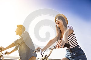 Happy young couple going for bicycle ride