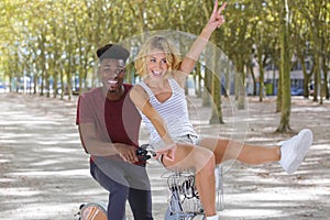 happy young couple going for summer bike ride