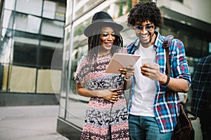 Happy young couple have fun in the city summertime outdoor smiling lifestyle