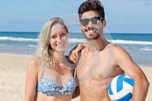 happy young couple having fun on beach