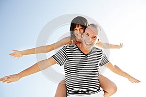 Happy young couple having fun outdoors.