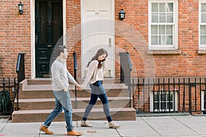 A happy young couple having a romantic moment in an urban setting in West Village in NYC