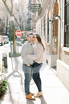 A happy young couple having a romantic moment in an urban setting in West Village in NYC