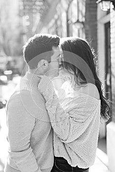 A happy young couple having a romantic moment in an urban setting in West Village in NYC