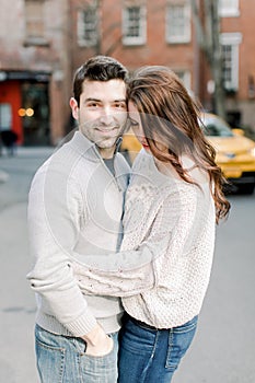 A happy young couple having a romantic moment in an urban setting in West Village in NYC