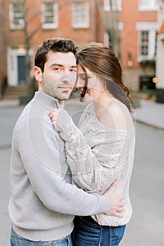 A happy young couple having a romantic moment in an urban setting in West Village in NYC