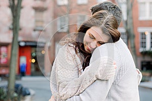 A happy young couple having a romantic moment in an urban setting in West Village in NYC