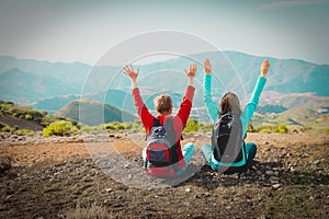 Happy young couple hiking in mountains, family enjoy travel