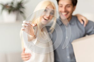 Happy Young Couple Holding New Home Key, Shallow Depth