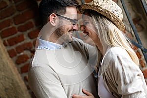 Happy young couple hugging and laughing