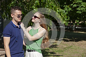 Happy young couple hugging and laughing outdoors