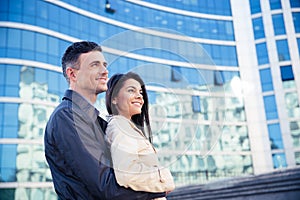 Happy young couple hugging outdoors