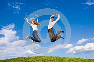 Happy Young Couple jumping