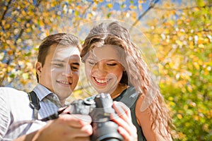 Happy young couple looking at camera