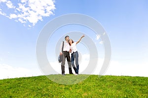 Happy young couple looking at something