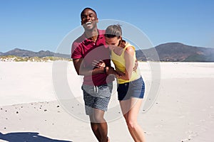 Happy young couple in love on beach