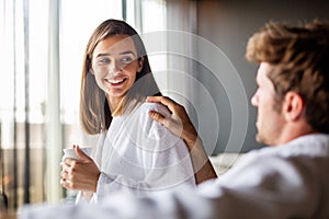 Happy young couple in love enjoying wellness spa resort treatments.